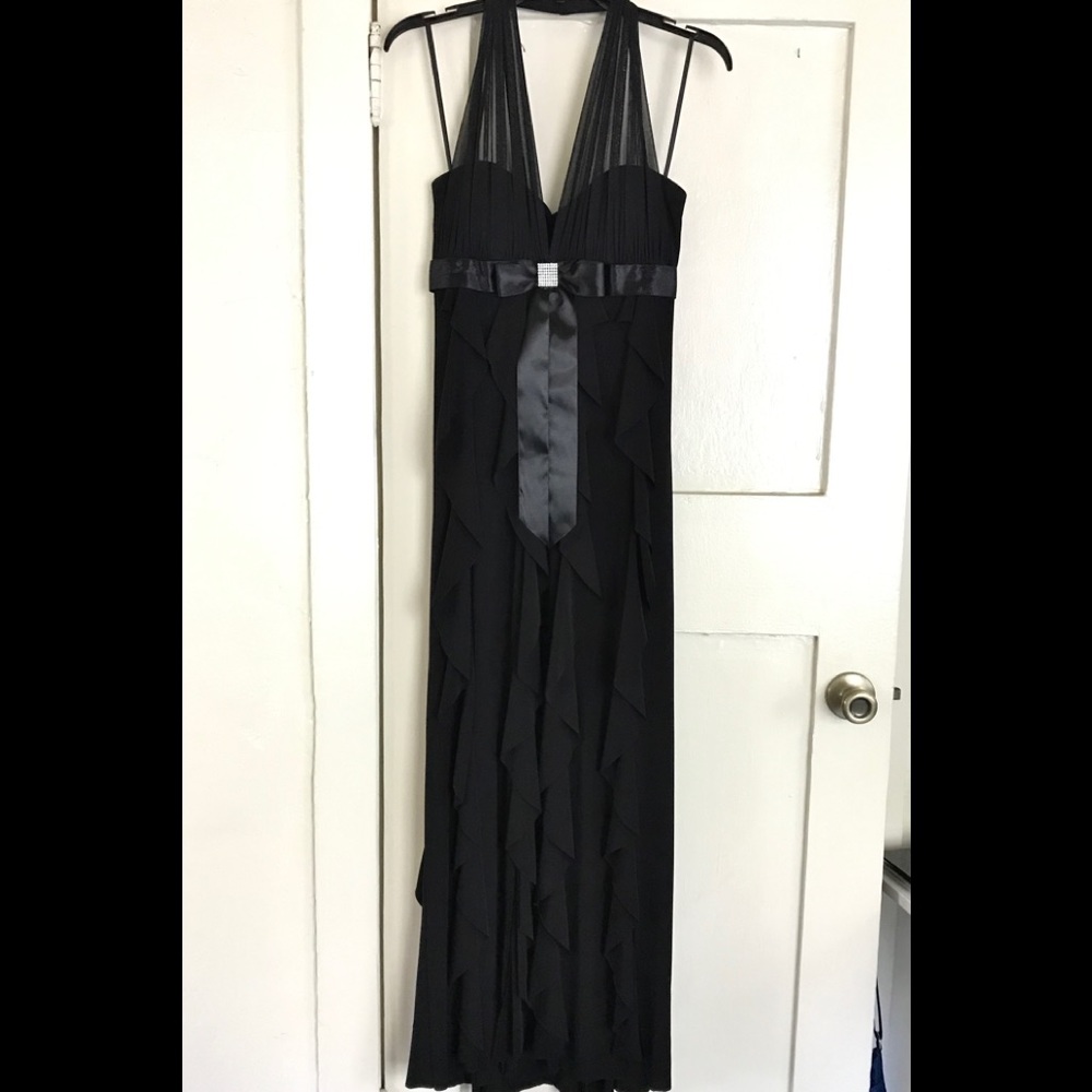 Elegant formal black dress with flowy ruffles silky accents weddings banquets